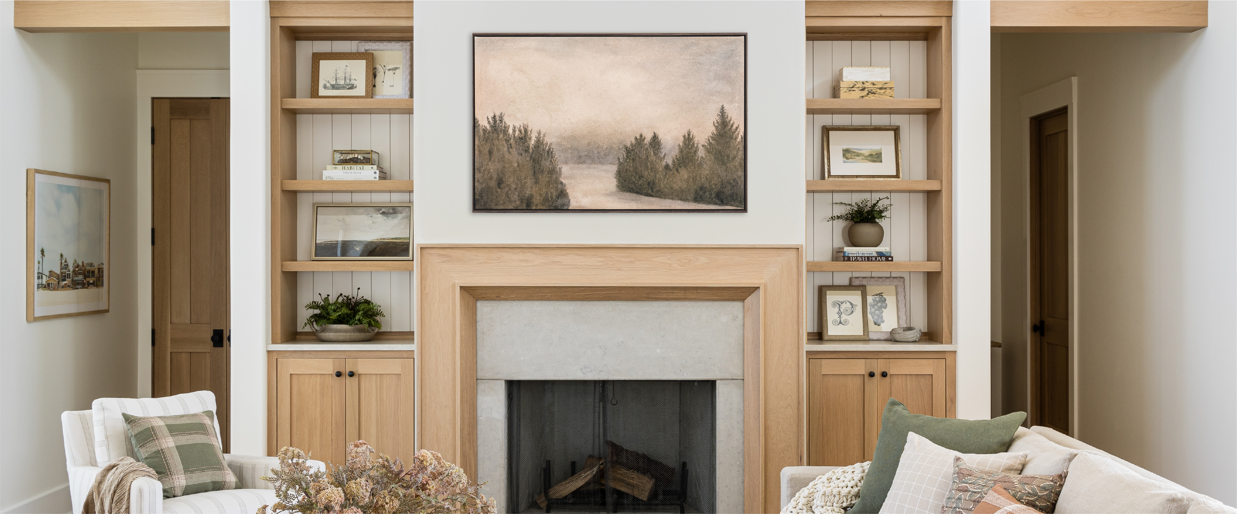 A photo of a living room mantle and shelves. 