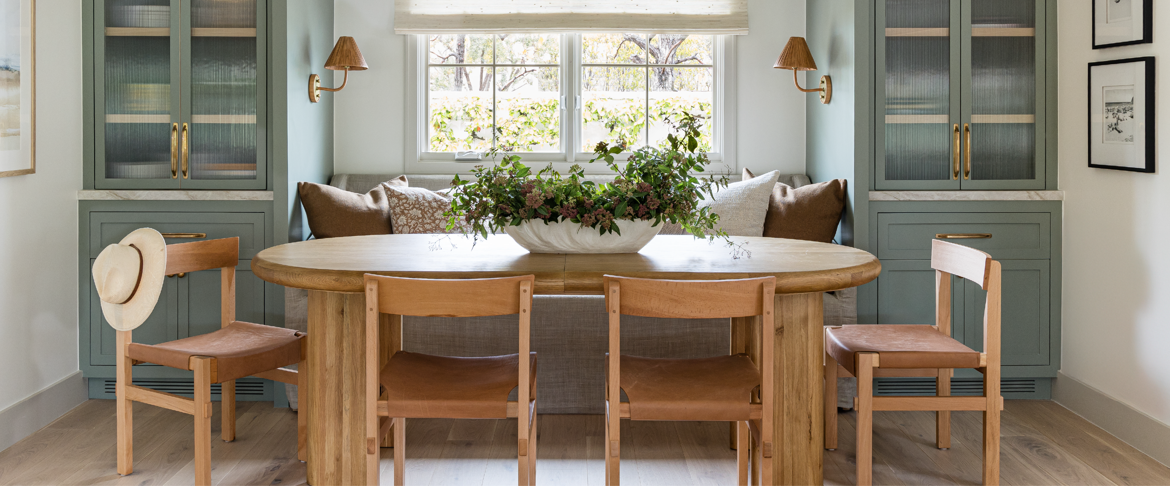 A photo of a dining table, chairs, and styling. 