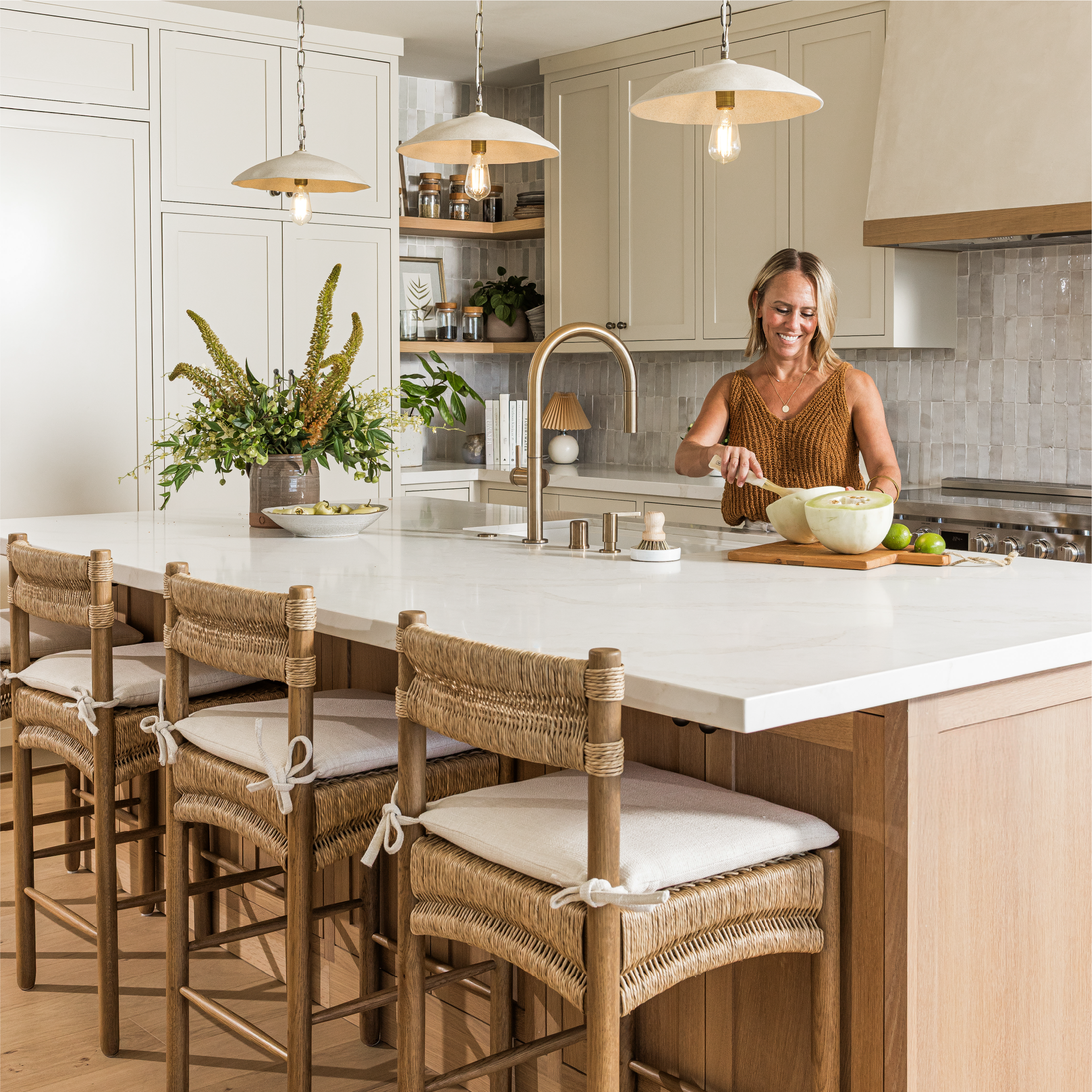 Image os a women at a kitchen island.